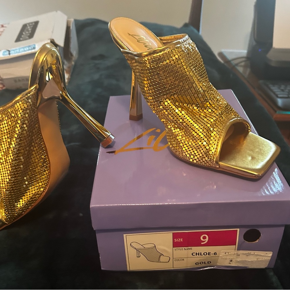 New In box Sz. 9 Gold slinky heel.